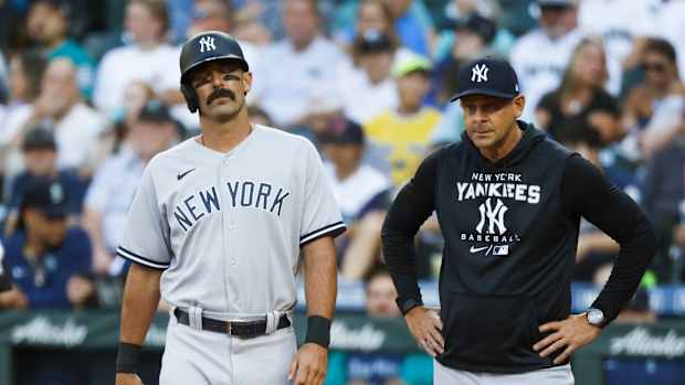 New York Yankees slugger Matt Carpenter reacts to foot injury with manager Aaron Boone